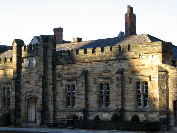 Exterior view of the Diocesan Registry. The shield on the right is that of Bishop Shute Barrington, who had it constructed.